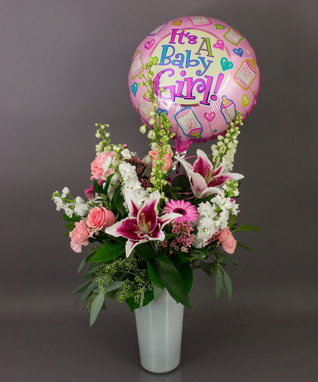 This beautiful vase of assorted fresh cut flowers is just right for the celebration of your new arrival.