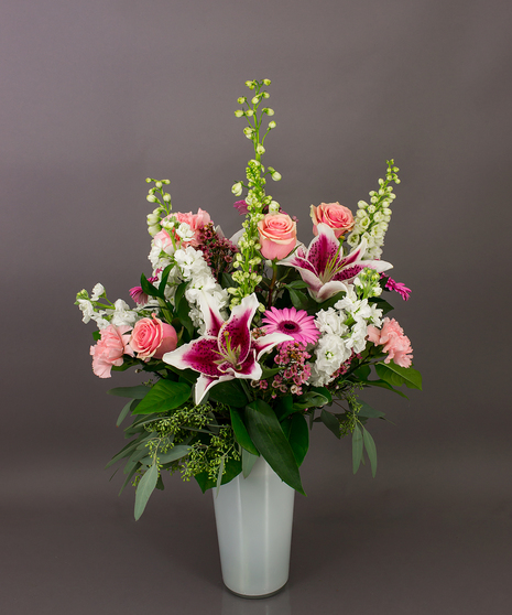 This beautiful vase of assorted fresh cut flowers is just right for the celebration of your new arrival.