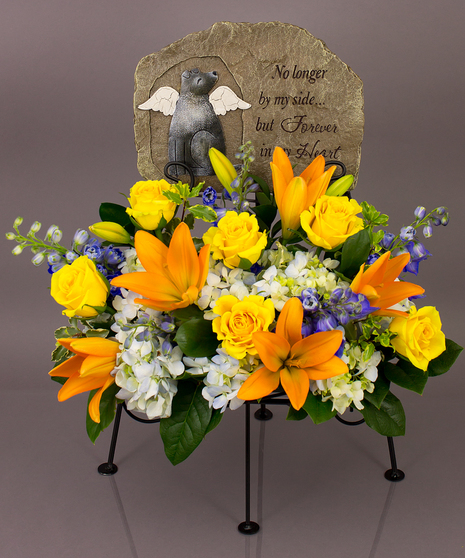 We will create a beautiful floral floral arrangement to celebrate a loved one and display your selected memorial plaque above it in our display stand.
