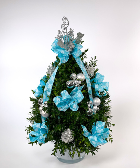 We've taken the finest premium boxwood tips from Virginia and designed a beautiful boxwood tree, then trimmed it with lights and beautiful ribbons, cones and ball clusters.