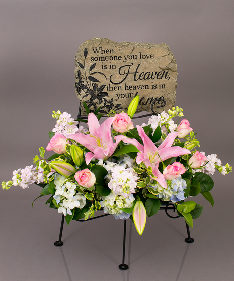 We will create a beautiful floral floral arrangement to celebrate a loved one and display your selected memorial plaque above it in our display stand.