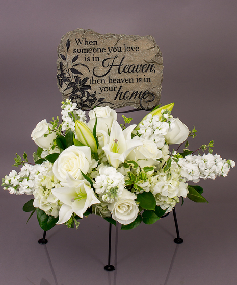 We will create a beautiful floral floral arrangement to celebrate a loved one and display your selected memorial plaque above it in our display stand.