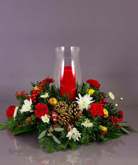 Our long lasting table centerpieces are designed from a variety of fresh cut winter greens, amaryllis, roses, orchids, and berries.