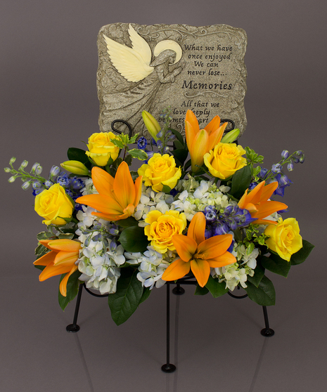 We will create a beautiful floral floral arrangement to celebrate a loved one and display your selected memorial plaque above it in our display stand.