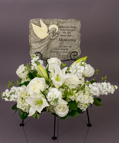 We will create a beautiful floral floral arrangement to celebrate a loved one and display your selected memorial plaque above it in our display stand.