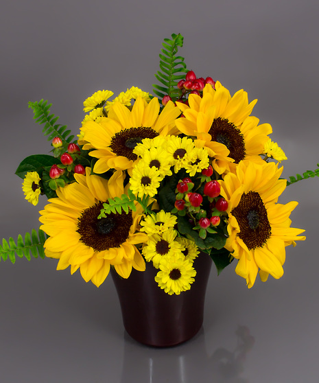 We've tried to capture that radiance using bright sunflowers and seasonal 