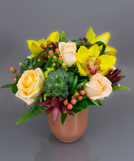 We've taken roses, hydrangea, succulents and added subtle foliage and berry accents to create this design.