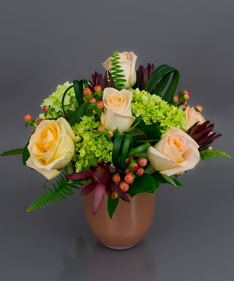 We've taken roses, hydrangea, succulents and added subtle foliage and berry accents to create this design.
