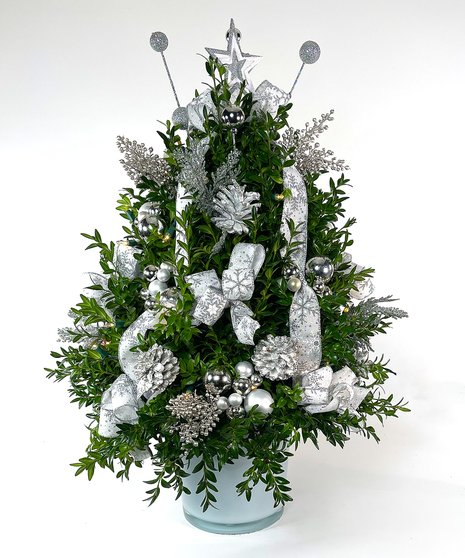 We've taken the finest premium boxwood tips from Virginia and designed a beautiful boxwood tree, then trimmed it with lights and beautiful ribbons, cones and ball clusters.