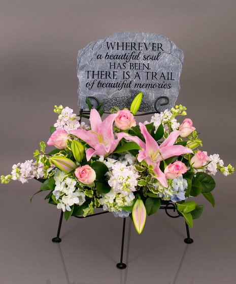 We will create a beautiful floral floral arrangement to celebrate a loved one and display your selected memorial plaque above it in our display stand.