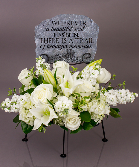 We will create a beautiful floral floral arrangement to celebrate a loved one and display your selected memorial plaque above it in our display stand.